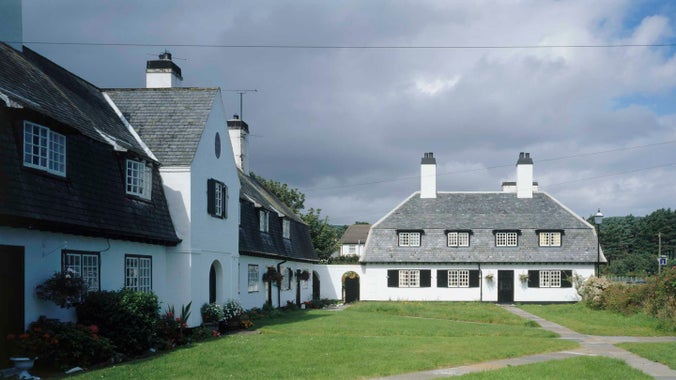 A view of the whitewashed terraced cottages in the square at Cushendun, Northern Ireland